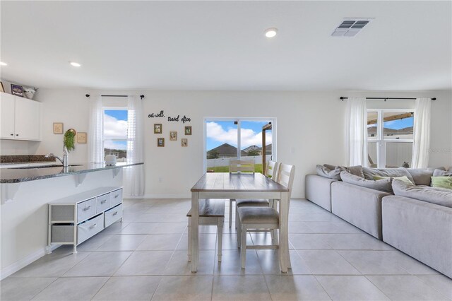1854 Juneberry St, Clermont, FL 34715 - dining area with light tile patterned floors and recessed lighting