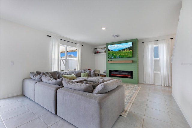 1854 Juneberry St, Clermont, FL 34715 - living area featuring light tile patterned floors, a large fireplace, and recessed lighting