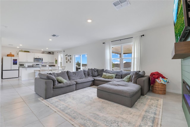 1854 Juneberry St, Clermont, FL 34715 - living room featuring light tile patterned floors and recessed lighting