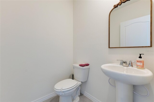 1854 Juneberry St, Clermont, FL 34715 - bathroom with toilet and baseboards