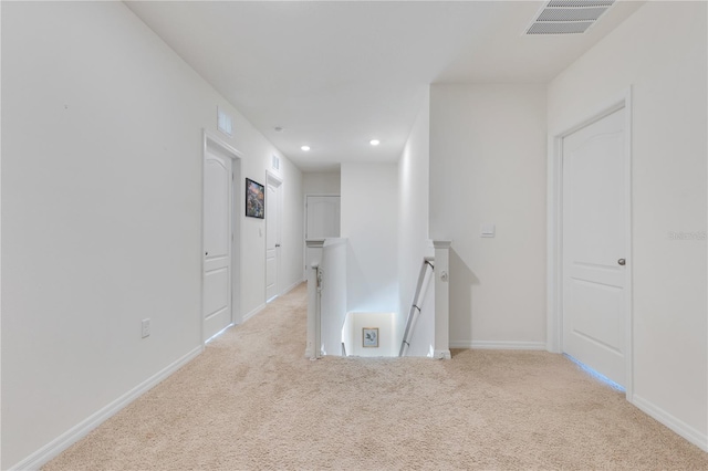 1854 Juneberry St, Clermont, FL 34715 - hallway with an upstairs landing, light colored carpet, and recessed lighting