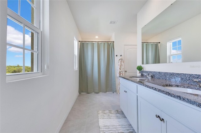 1854 Juneberry St, Clermont, FL 34715 - full bath featuring double vanity, tile patterned floors, a shower with curtain, and recessed lighting