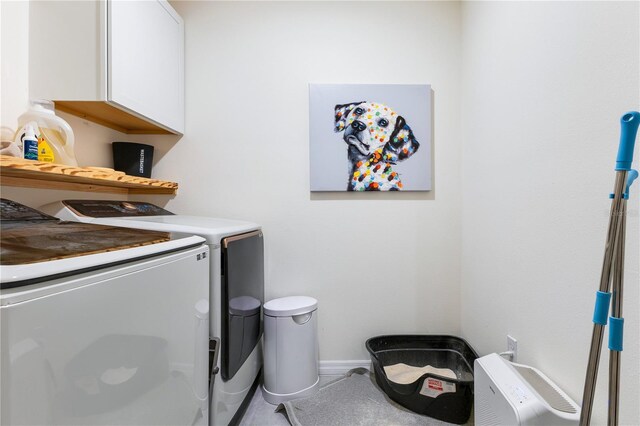 1854 Juneberry St, Clermont, FL 34715 - laundry room with cabinet space and washer and clothes dryer