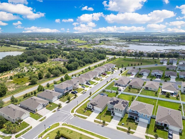 1854 Juneberry St, Clermont, FL 34715 - aerial view of residential area with a large body of water