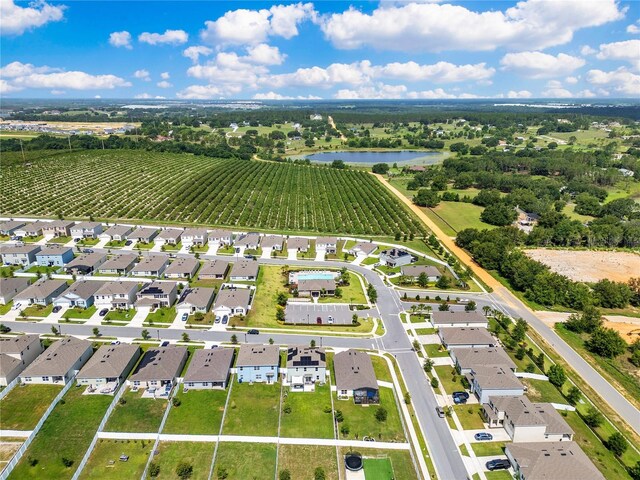 1854 Juneberry St, Clermont, FL 34715 - aerial view of sparsely populated area featuring farmland, nearby suburban area, and a nearby body of water