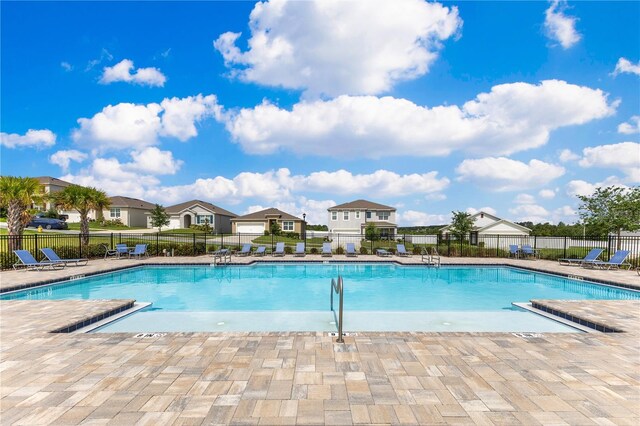 1854 Juneberry St, Clermont, FL 34715 - community pool featuring a patio and a residential view