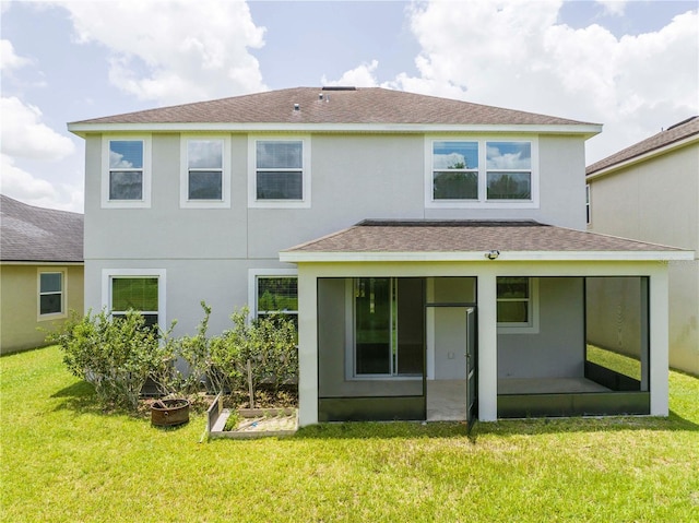5161 Dove Tree St, Orlando, FL 32811 - rear view of property with a sunroom, roof with shingles, a yard, and stucco siding