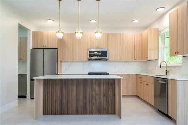 5161 Dove Tree St, Orlando, FL 32811 - kitchen featuring stainless steel appliances, a kitchen island, backsplash, pendant lighting, and recessed lighting