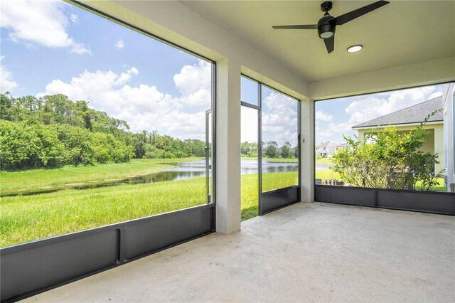 5161 Dove Tree St, Orlando, FL 32811 - unfurnished sunroom with a water view and a ceiling fan