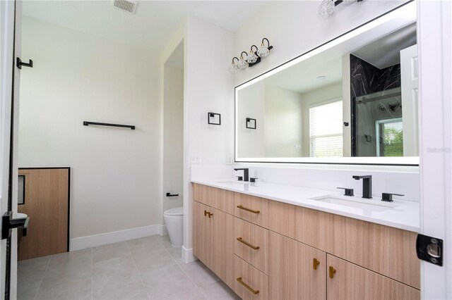 5161 Dove Tree St, Orlando, FL 32811 - full bathroom with double vanity, a shower stall, and tile patterned floors