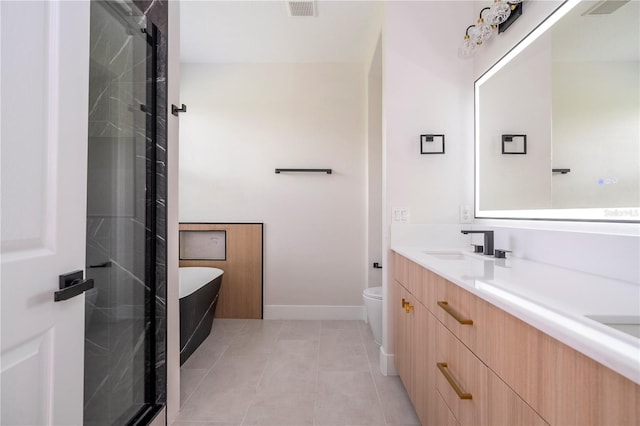 5161 Dove Tree St, Orlando, FL 32811 - bathroom with double vanity, a freestanding tub, tile patterned flooring, and a stall shower