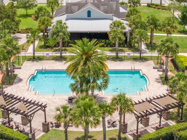5161 Dove Tree St, Orlando, FL 32811 - community pool with a pergola and a patio