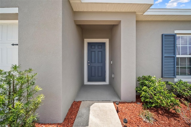 489 Panaro Ln, Haines City, FL 33844 - doorway to property with stucco siding