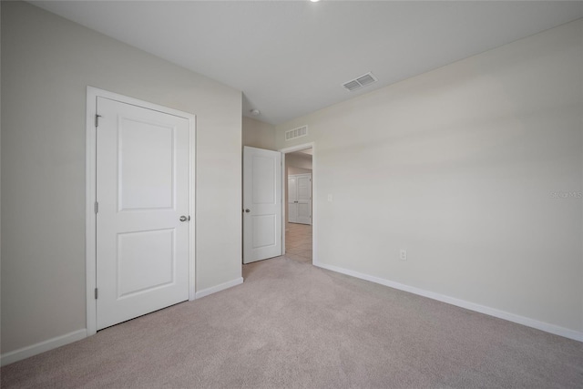 489 Panaro Ln, Haines City, FL 33844 - unfurnished bedroom featuring light carpet and baseboards