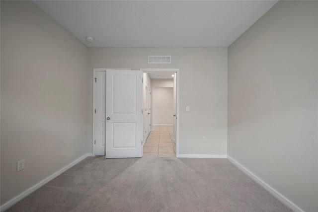 489 Panaro Ln, Haines City, FL 33844 - empty room with baseboards and light carpet