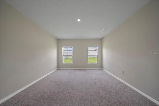 489 Panaro Ln, Haines City, FL 33844 - empty room featuring baseboards, carpet, and recessed lighting