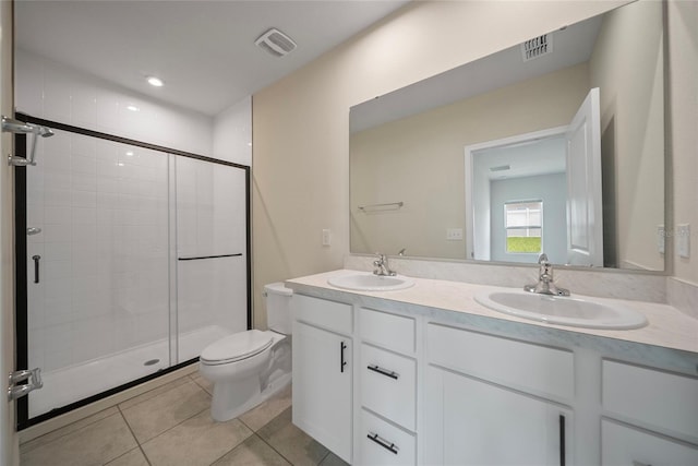 489 Panaro Ln, Haines City, FL 33844 - bathroom featuring double vanity, a stall shower, and tile patterned floors