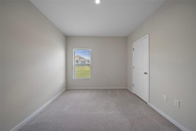 489 Panaro Ln, Haines City, FL 33844 - empty room with light colored carpet and baseboards