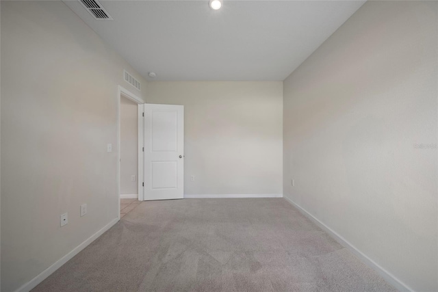 489 Panaro Ln, Haines City, FL 33844 - carpeted spare room featuring baseboards