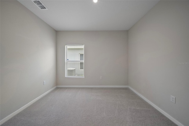489 Panaro Ln, Haines City, FL 33844 - unfurnished room with baseboards and light carpet