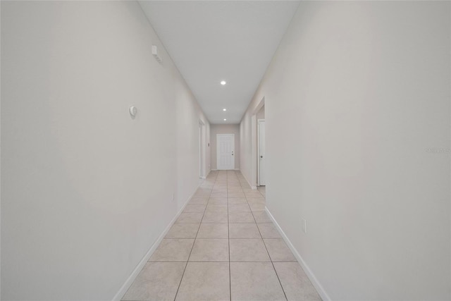 489 Panaro Ln, Haines City, FL 33844 - hallway featuring light tile patterned floors, recessed lighting, and baseboards