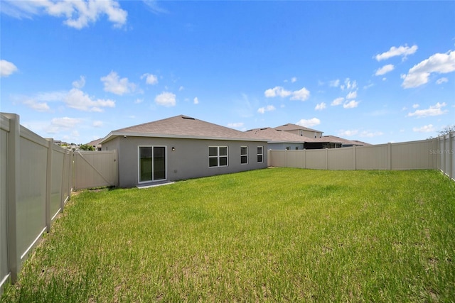 489 Panaro Ln, Haines City, FL 33844 - back of house featuring stucco siding