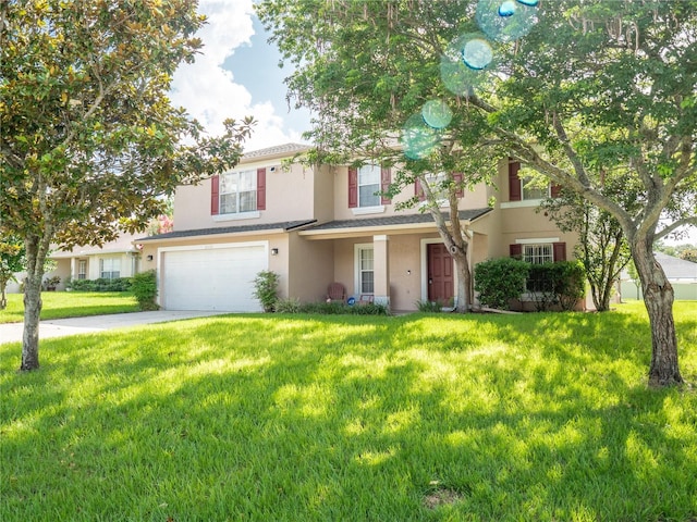 8330 Lainie Ln, Orlando, FL 32818 - view of front of property with stucco siding, a garage, concrete driveway, and a front yard
