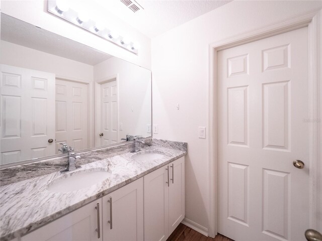 8330 Lainie Ln, Orlando, FL 32818 - full bath with double vanity and wood finished floors