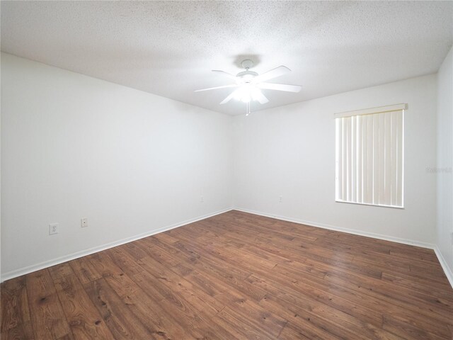 8330 Lainie Ln, Orlando, FL 32818 - spare room featuring a ceiling fan, dark wood-type flooring, and a textured ceiling