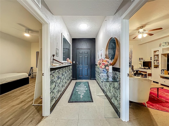 6336 Buford St Unit 207, Orlando, FL 32835 - foyer featuring a ceiling fan and a textured ceiling