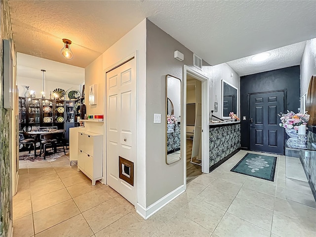 6336 Buford St Unit 207, Orlando, FL 32835 - hall featuring a textured ceiling and light tile patterned floors