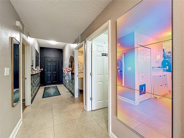 6336 Buford St Unit 207, Orlando, FL 32835 - hall featuring light tile patterned floors and a textured ceiling