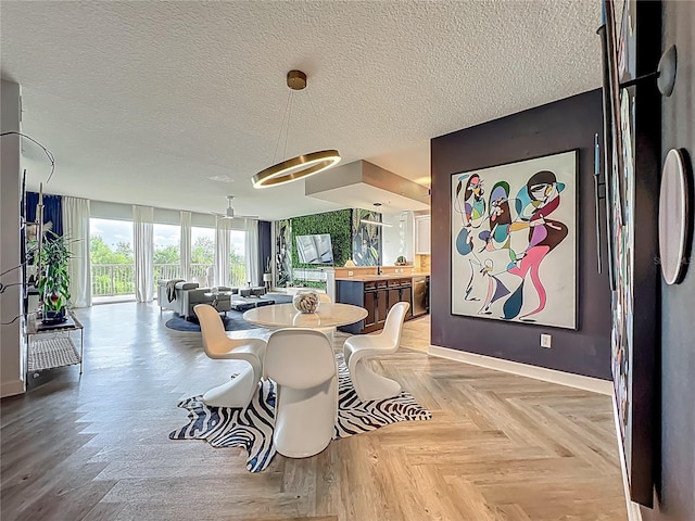 6336 Buford St Unit 207, Orlando, FL 32835 - dining room featuring a textured ceiling