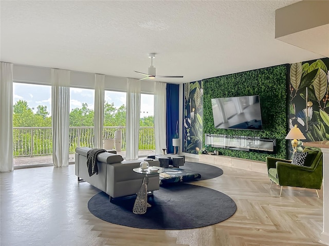 6336 Buford St Unit 207, Orlando, FL 32835 - living room with a textured ceiling, a ceiling fan, and wallpapered walls
