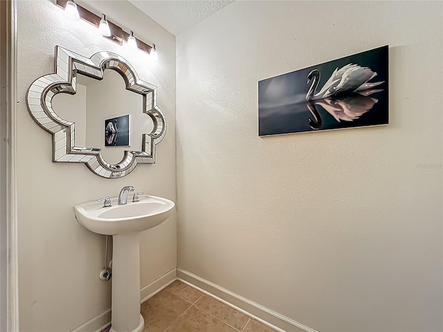 6336 Buford St Unit 207, Orlando, FL 32835 - bathroom with tile patterned floors and baseboards