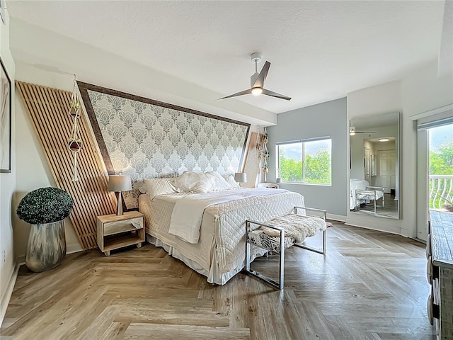 6336 Buford St Unit 207, Orlando, FL 32835 - bedroom with an accent wall, access to outside, and ceiling fan