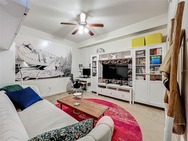 6336 Buford St Unit 207, Orlando, FL 32835 - living room featuring a textured ceiling, a ceiling fan, light carpet, and a desk
