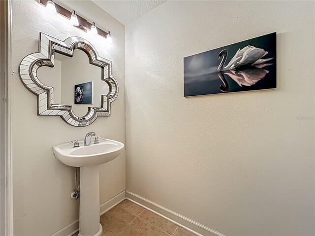 6336 Buford St Unit 207, Orlando, FL 32835 - bathroom featuring tile patterned flooring and baseboards