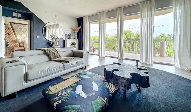6336 Buford St Unit 207, Orlando, FL 32835 - living area featuring a textured ceiling