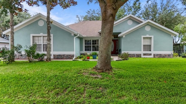 36646 Oconee Ave, Eustis, FL 32736 - ranch-style house featuring stucco siding and a front lawn
