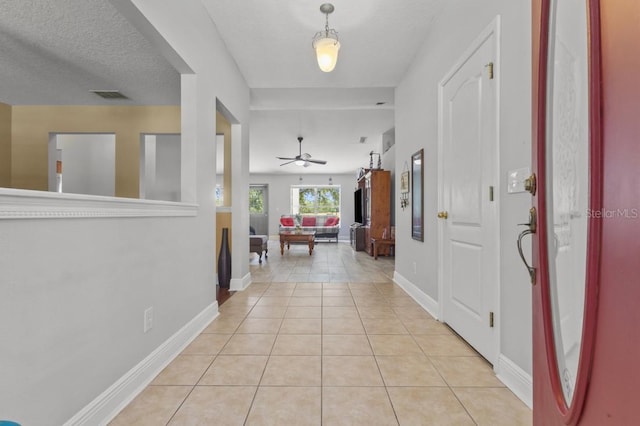 36646 Oconee Ave, Eustis, FL 32736 - foyer entrance featuring ceiling fan, light tile patterned floors, and baseboards