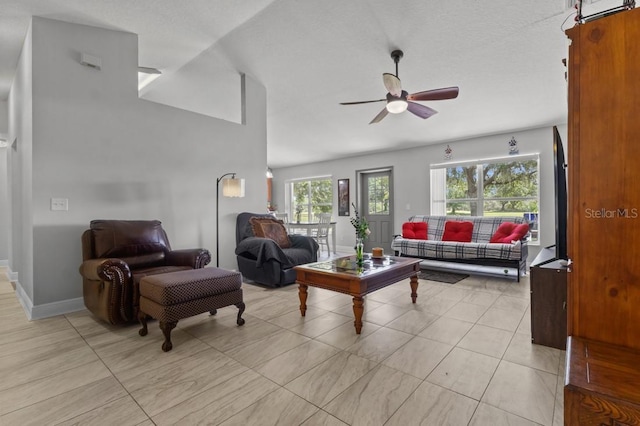 36646 Oconee Ave, Eustis, FL 32736 - living room with a ceiling fan, baseboards, and light tile patterned floors