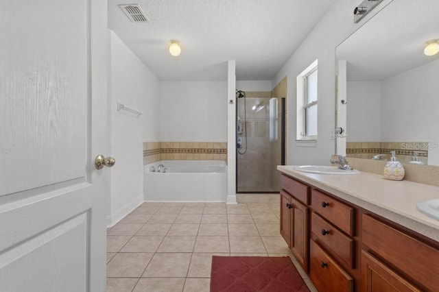 36646 Oconee Ave, Eustis, FL 32736 - full bath featuring tile patterned flooring, a garden tub, a stall shower, double vanity, and baseboards