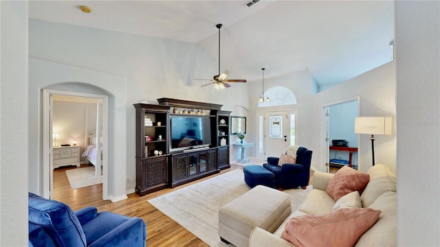 14723 Pine Cone Trl, Clermont, FL 34711 - living room with a ceiling fan, wood finished floors, and high vaulted ceiling
