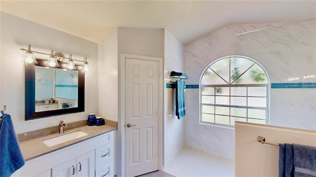 14723 Pine Cone Trl, Clermont, FL 34711 - bathroom with a marble finish shower, vanity, and lofted ceiling