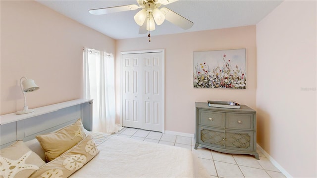 14723 Pine Cone Trl, Clermont, FL 34711 - tiled bedroom with a closet and a ceiling fan