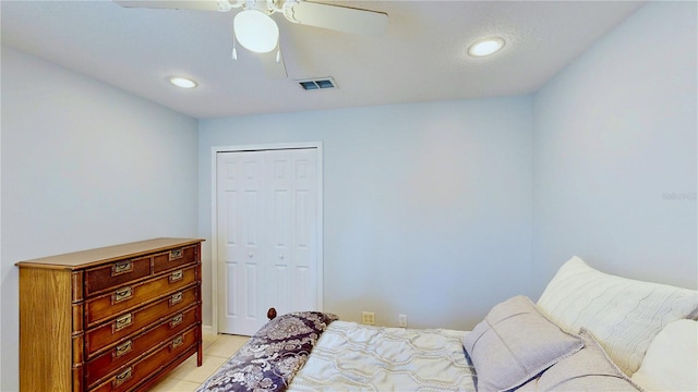 14723 Pine Cone Trl, Clermont, FL 34711 - bedroom featuring a closet, recessed lighting, light tile patterned flooring, and ceiling fan