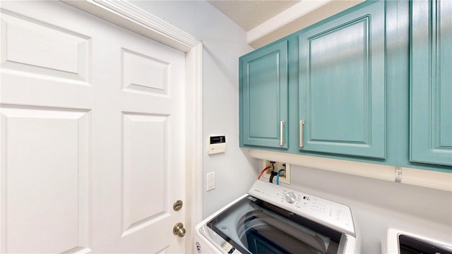 14723 Pine Cone Trl, Clermont, FL 34711 - laundry room with washer / dryer and cabinet space