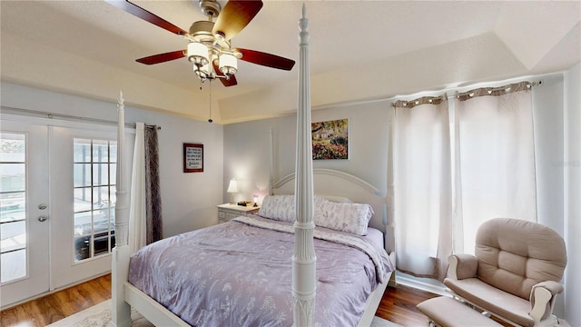 14723 Pine Cone Trl, Clermont, FL 34711 - bedroom featuring wood finished floors, ceiling fan, and french doors
