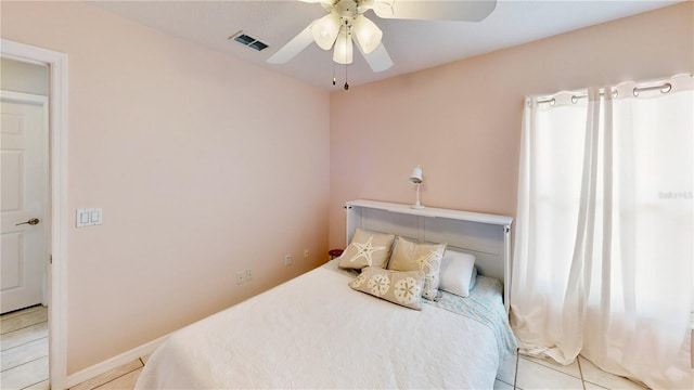 14723 Pine Cone Trl, Clermont, FL 34711 - bedroom with light tile patterned flooring and a ceiling fan